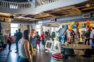 photo robot from mihi entertainment showing off to event professionals at an event.