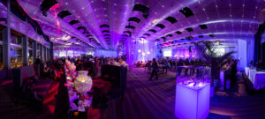 Panoramic view of a corporate event at Seawell Ballroom, illustrating a well-executed event backup plan with lighting, lounge seating, and guest flow. Photo by Studio JK Photography.